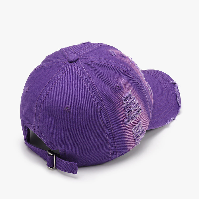 Distressed adjustable cotton purple baseball cap with a worn, vintage-inspired look.