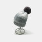 Stylish Gradient Knit Beanie with Pom-Pom
This cozy and fashionable hat features a gradient pattern in shades of grey, with a plush pom-pom on top, creating a trendy and versatile winter accessory.