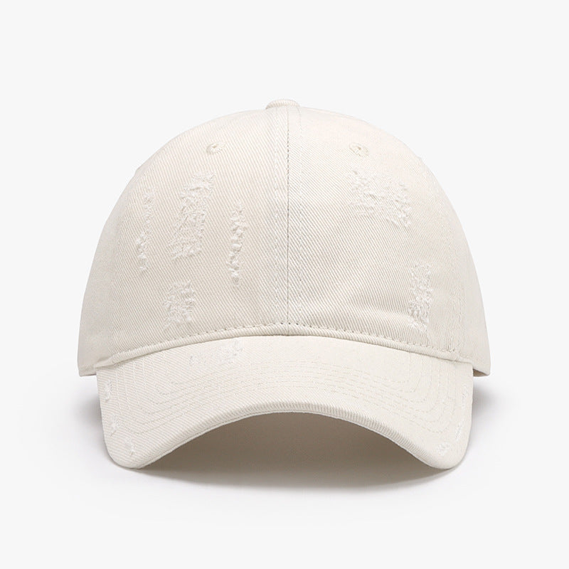 Adjustable cotton baseball hat with distressed detailing, perfect for everyday casual wear.