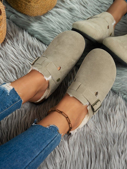 Plush suede round toe slippers on cozy gray fur rug