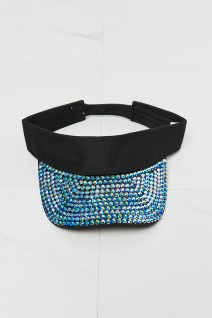 Stylish crystal-embellished visor hat with adjustable strap for a fashionable accessory.