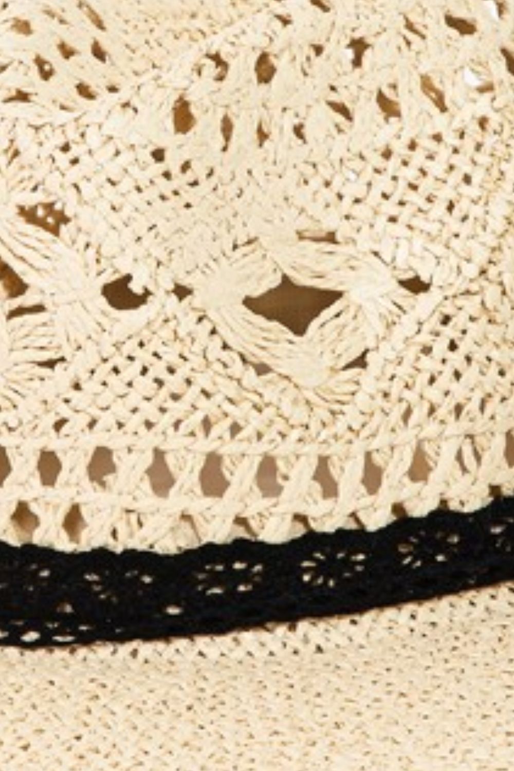 Elegant crochet brim hat with intricate openwork lace detail in a neutral beige tone.