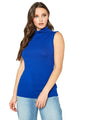 Sleeveless blue turtle neck fitted top worn by a young woman with long brown hair against a white background.