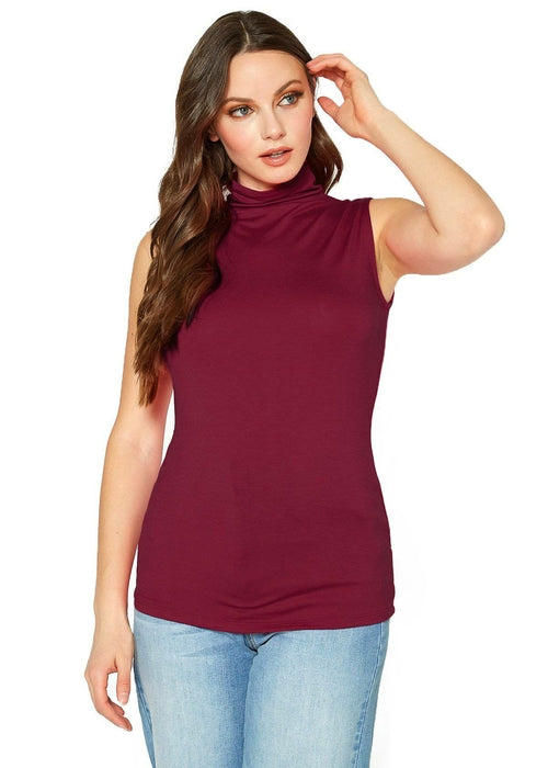 Sleeveless maroon fitted top with turtleneck style, worn by woman with long wavy dark hair standing against a white background.