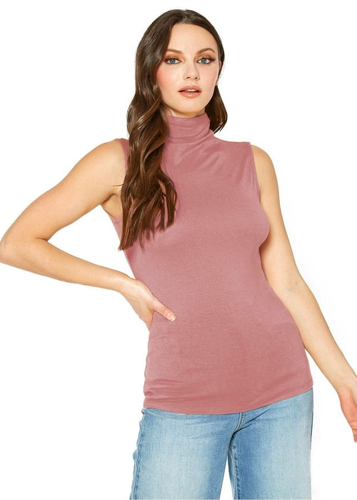 Sleeveless pink turtleneck fitted top by Lemon Hera, featuring a young woman with long wavy hair posing against a plain white background.