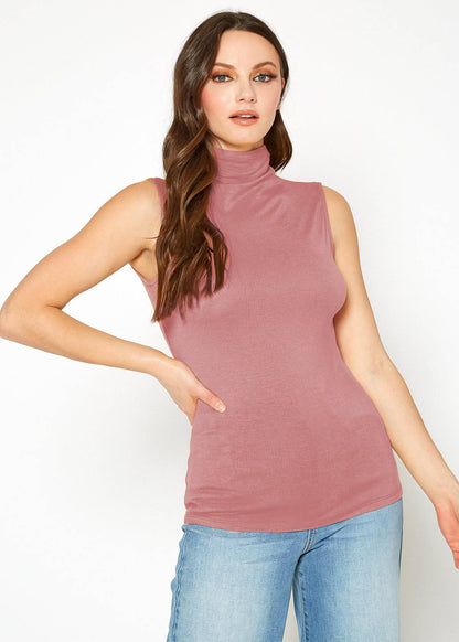 Sleeveless pink turtle neck fitted top with wavy brown hair model