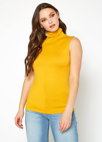 Sleeveless yellow turtle neck top worn by a woman with long wavy hair against a plain white background.