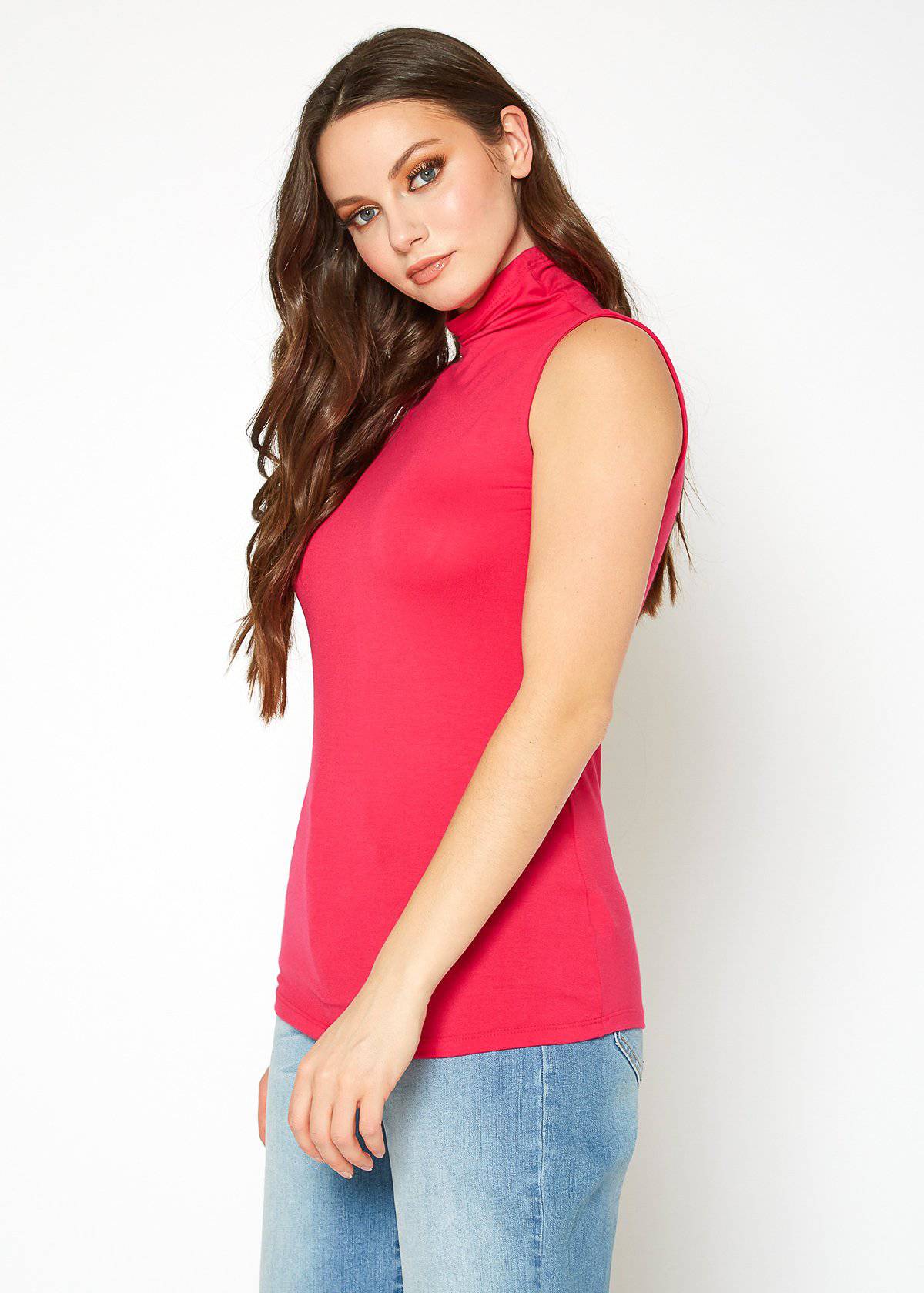 Sleeveless, fitted turtleneck top in vibrant pink color