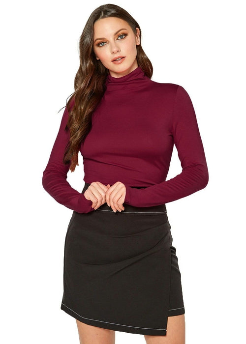 Stylish maroon turtleneck top with long sleeves, showcased on a female model with long wavy hair.