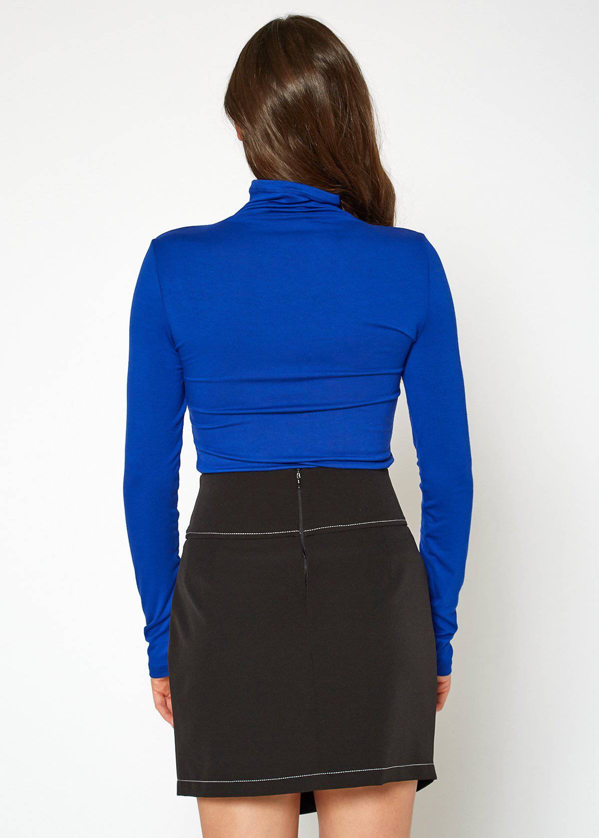 Fitted blue turtleneck top for women with long sleeves, showcasing a stylish and modern design.