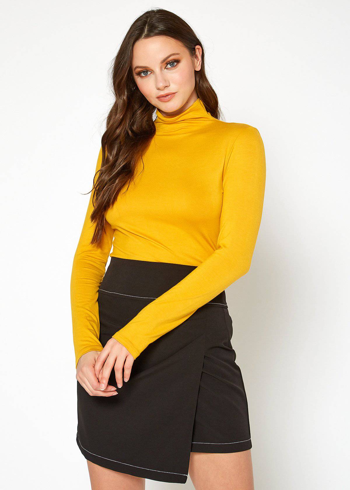 Women's long sleeve mustard yellow turtleneck top with fitted design