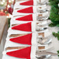 Christmas Hat Cutlery Holders: Festive red and white holiday décor for a cozy, seasonal table setting