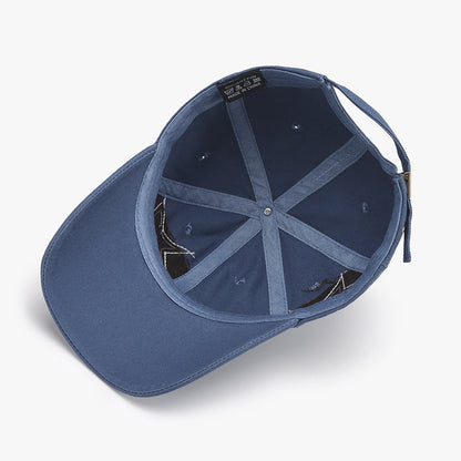 Adjustable navy blue cap with a star design and raw hem details, showcasing a minimalist and casual style.