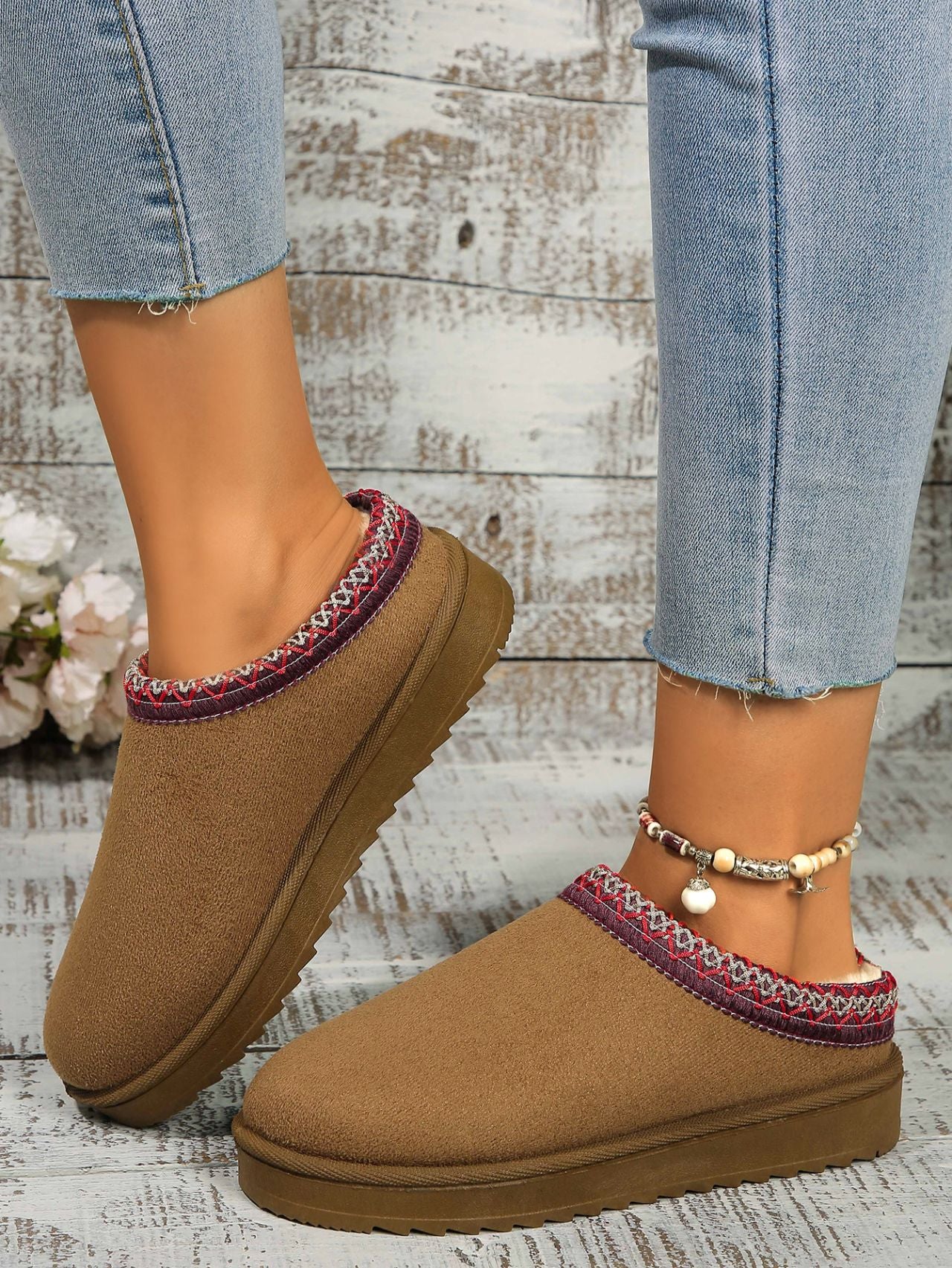 Cozy round toe platform slippers with vibrant trim detail, perfect for casual everyday wear.