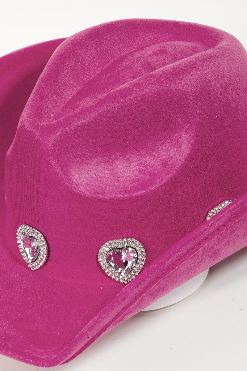 Rhinestone-encrusted fuchsia cowboy hat with heart-shaped details