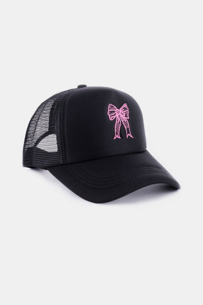 Feminine Flair Trucker Hat: Stylish black trucker cap with pink bow embroidery, offering a chic and casual accessory.