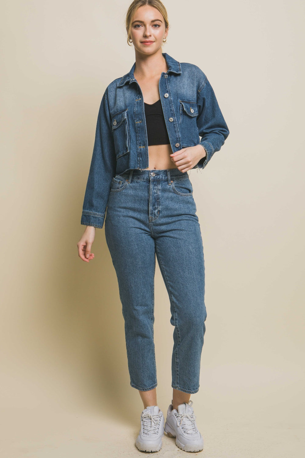 Denim delight: Cropped raw hem button-up denim jacket on a fitted female model