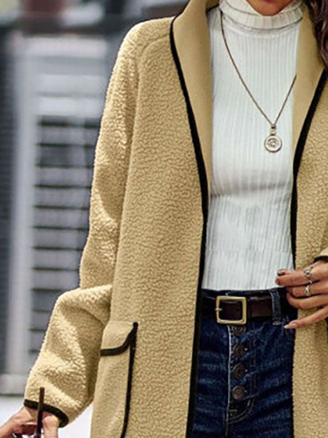 Full Size Contrast Trim Long Sleeve Coat with Pockets - Warm beige teddy bear jacket, white knit sweater, denim jeans, and statement necklace.