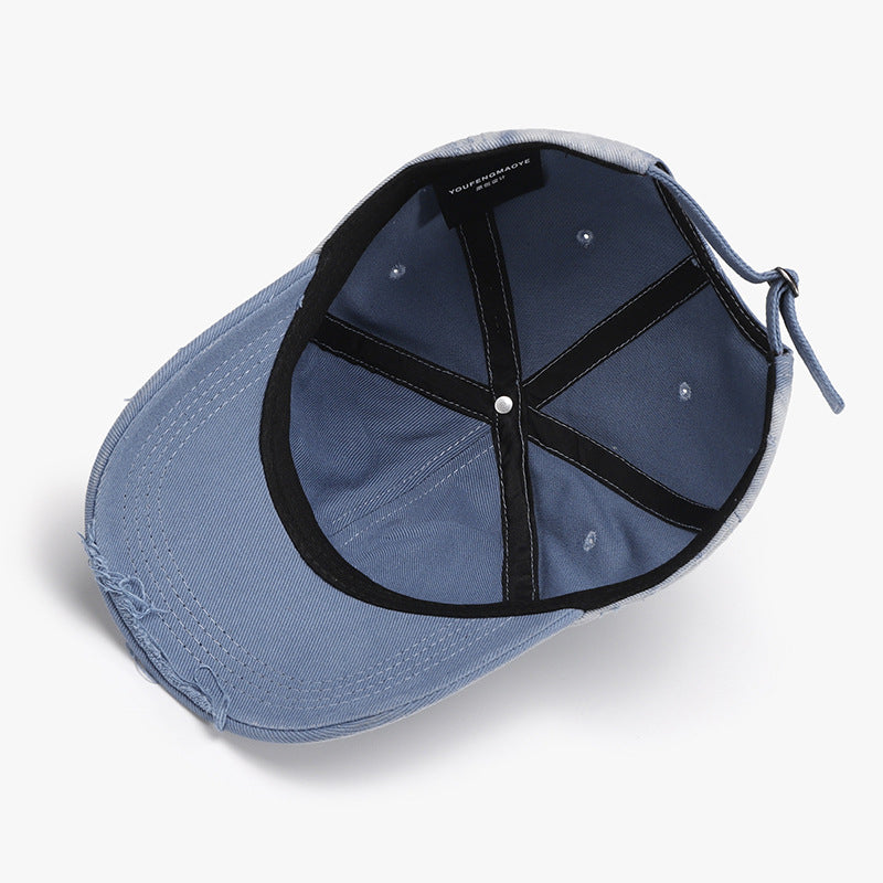 Adjustable distressed cotton hat with black criss-cross detail