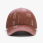 Adjustable cotton baseball hat in a distressed pink color, featuring a casual and fashionable design for the modern woman.