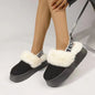 Plush platform slippers with letter strap, cozy fur trim, and textured sole for comfort and style.