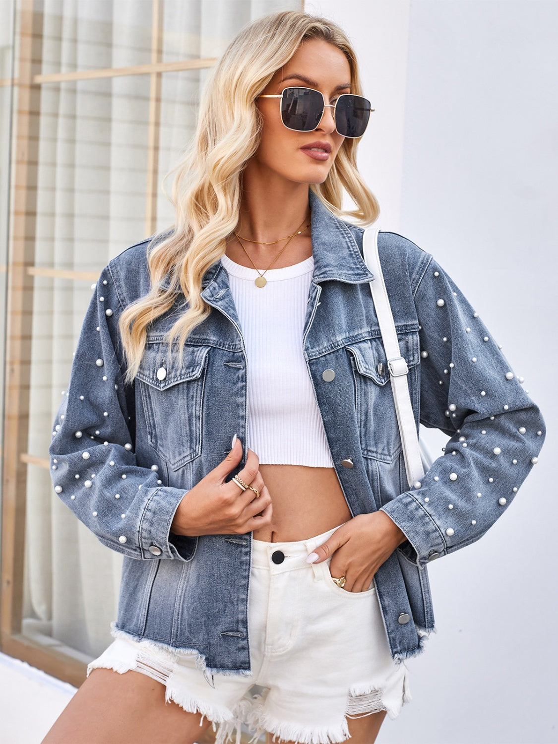 Pearl Trim Raw Hem Denim Jacket - Distressed denim jacket with pearl embellishments, oversized pockets, and a raw hemline.