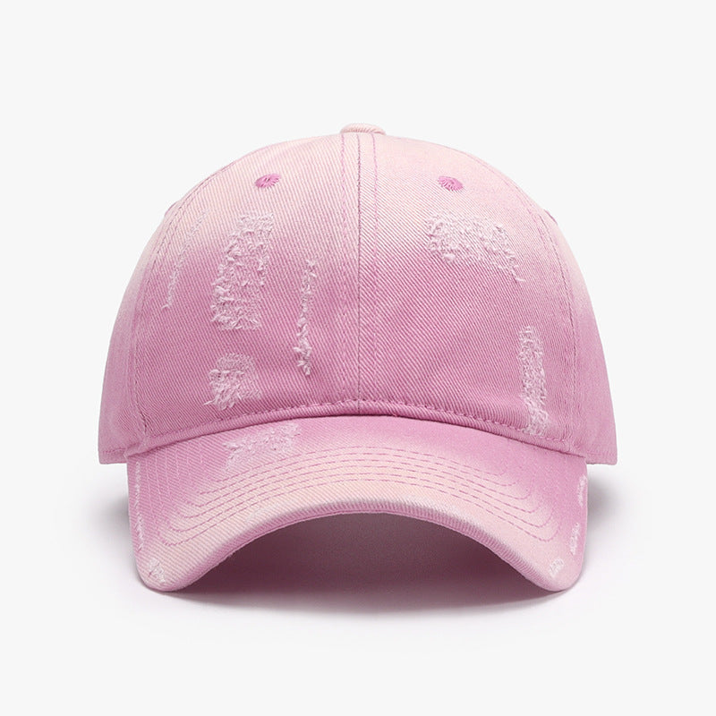 Stylish pink cotton baseball cap with subtle distressed details