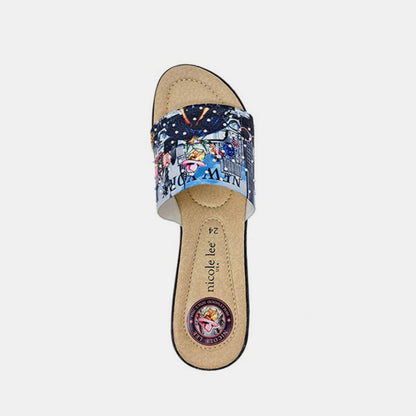 Rhinestone-decorated casual wedge slippers with a navy blue patterned fabric upper, featuring a colorful cartoon-style design.