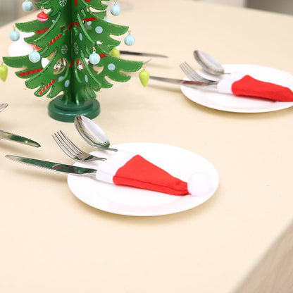 Festive Christmas Table Setting with Ornamental Tree Holder and Cutlery