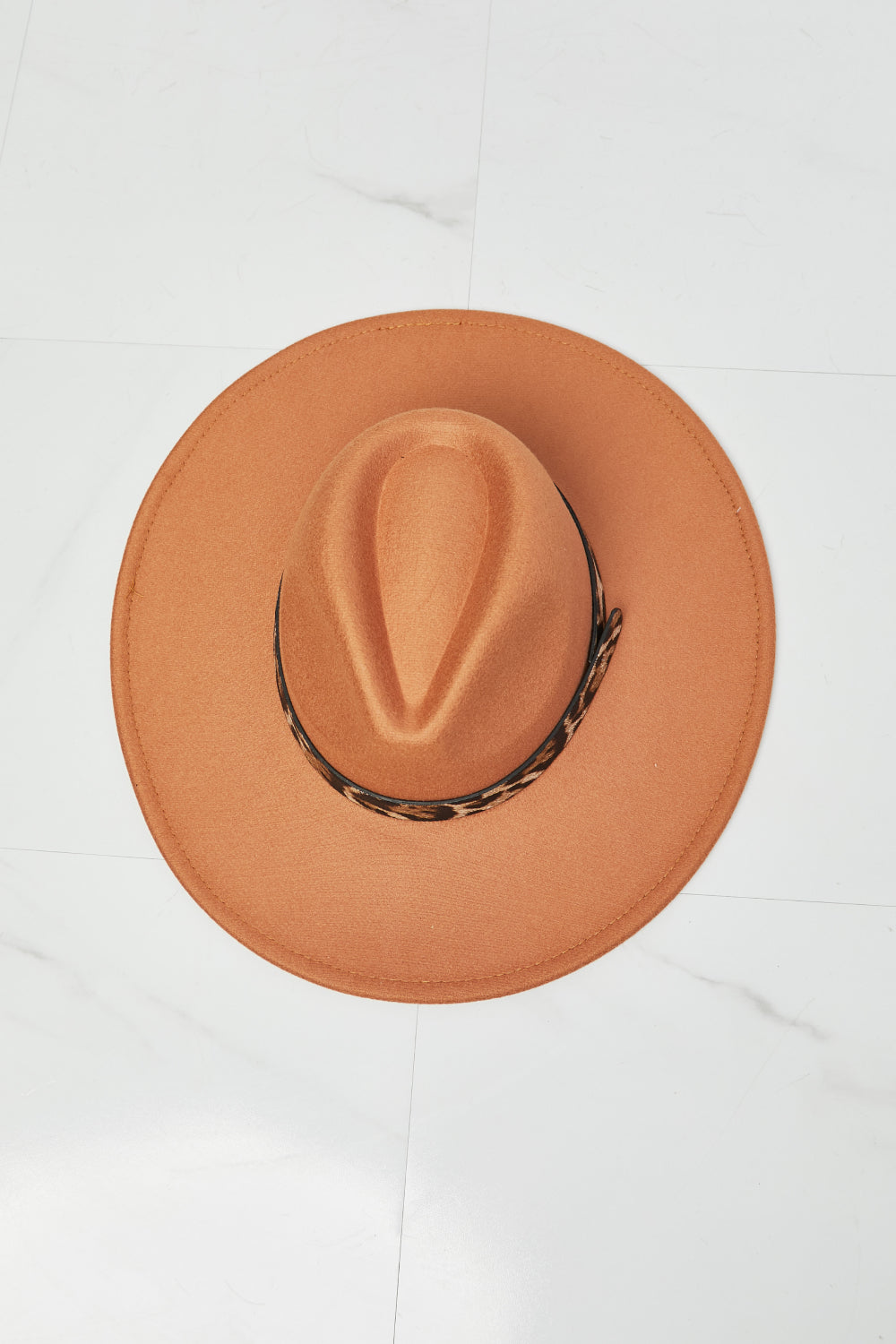 Stylish orange fedora hat with leopard print detail