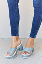 Chic platform sandals in misty blue, a stylish footwear choice for the modern fashionista.