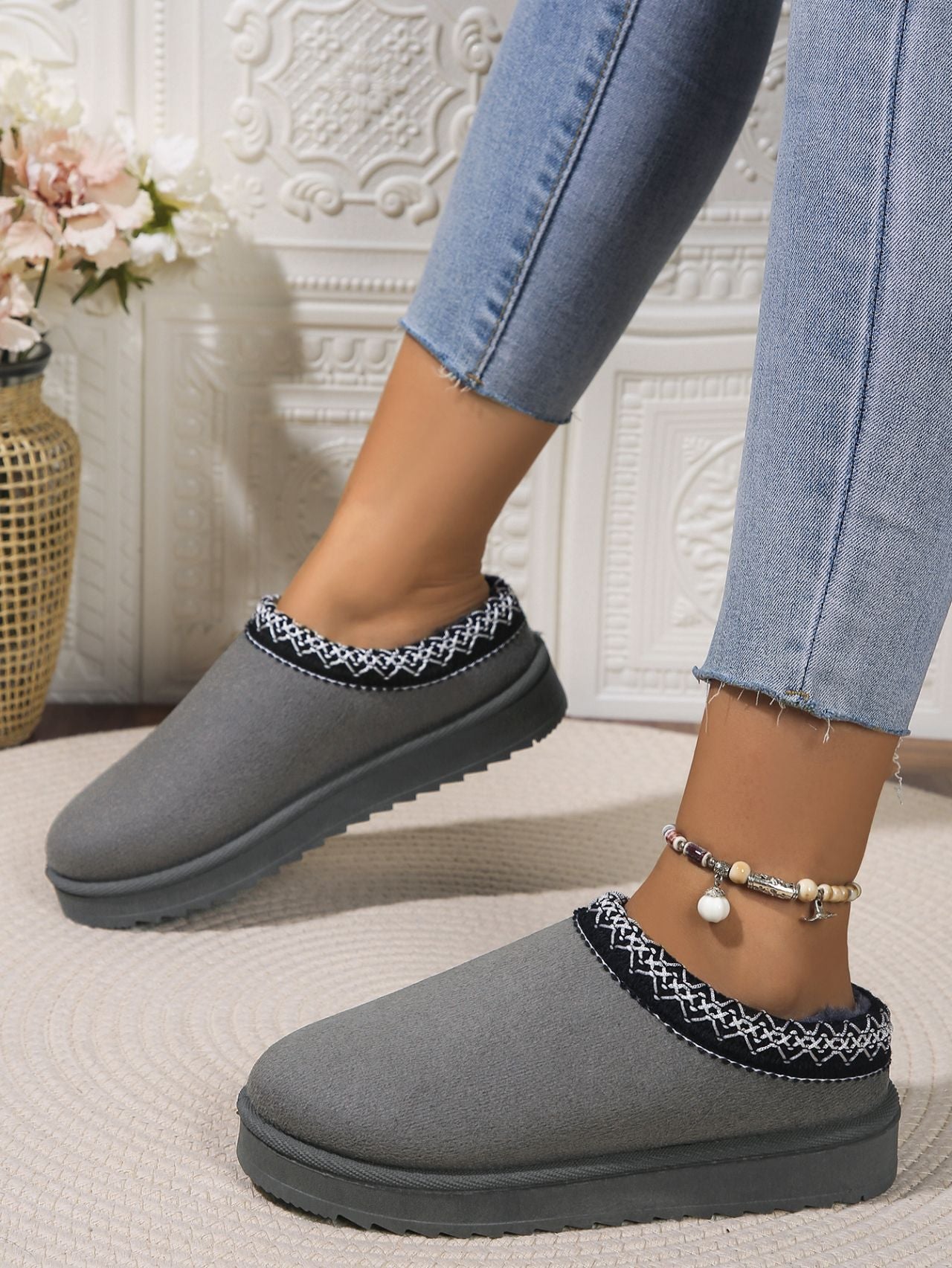 Stylish gray platform slippers with a checkered pattern trim, perfect for casual yet comfortable wear.