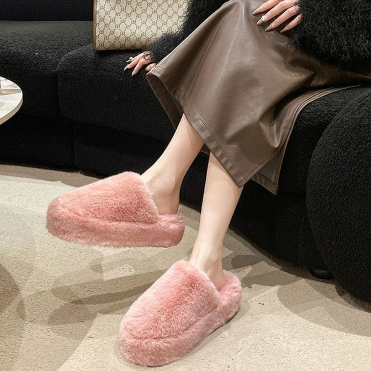 Fuzzy pink round toe slippers with plush comfort, perfect for casual lounging.