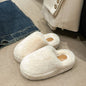 Plush Fuzzy Round Toe Flat Slippers on a carpeted floor near a white appliance