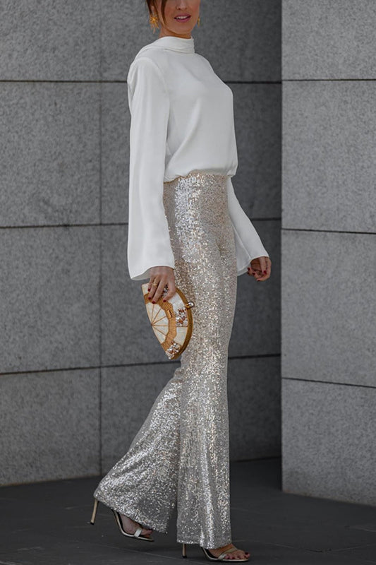 Glamorous sequin flare skirt paired with a chic ivory blouse, creating a stylish and sophisticated look.