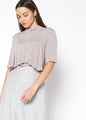 Mock Neck Short Sleeve Ruffled Yoke Top by Lemon Hera, a stylish and comfortable women's fashion piece in a neutral color palette.