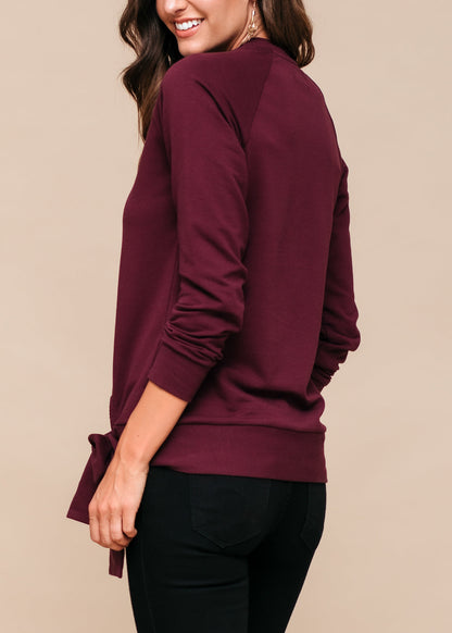 Women's Crew Neck Tie Knot Burgundy Sweatshirt from Lemon Hera fashion brand, featuring a flattering cut and comfortable fabric for casual, everyday wear.