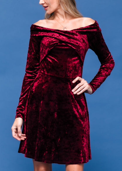 Elegant red velvet off-shoulder dress with a figure-flattering silhouette, perfect for a night out or special occasion.