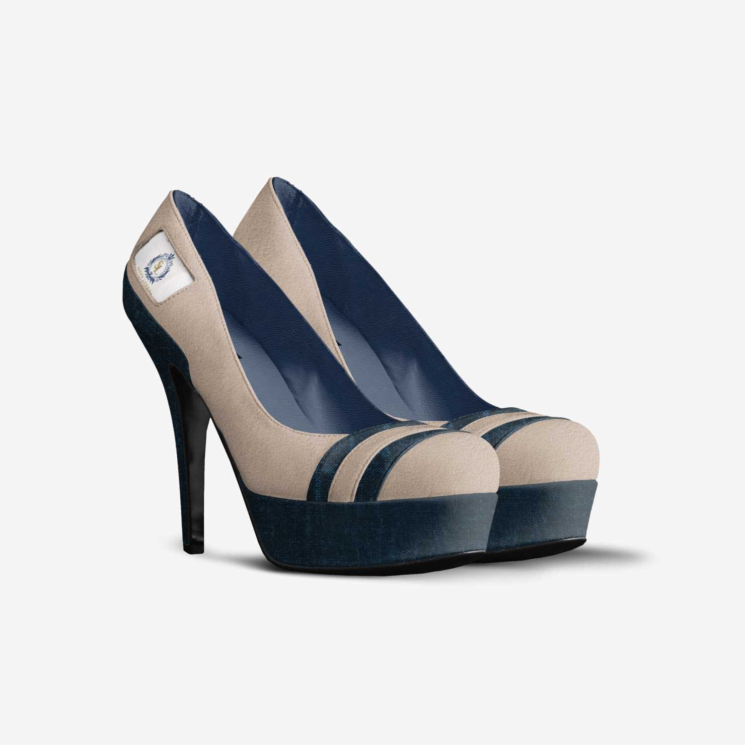 Elegant high heeled pumps in navy and beige tones. The stylish shoes feature a platform sole and pointed toe design, ideal for formal or evening wear.