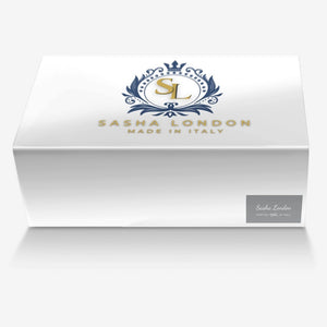 Elegant white box with navy and gold Sasha London branding, showcasing luxury Italian-made fashion accessory.