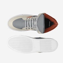 Load image into Gallery viewer, Sleek leather and suede sneakers with contrasting gray and orange accents, featuring a textured rubber sole for comfortable wear.