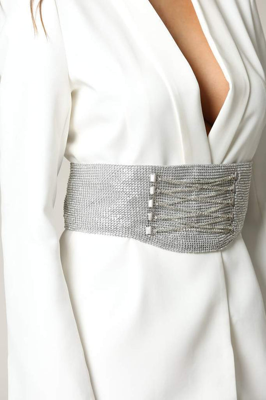 Sparkling silver corset belt adorns flowing white dress