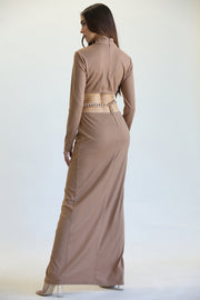 Elegant high-neck maxi dress with ribbed texture, showcasing a woman's stylish figure against a plain background.