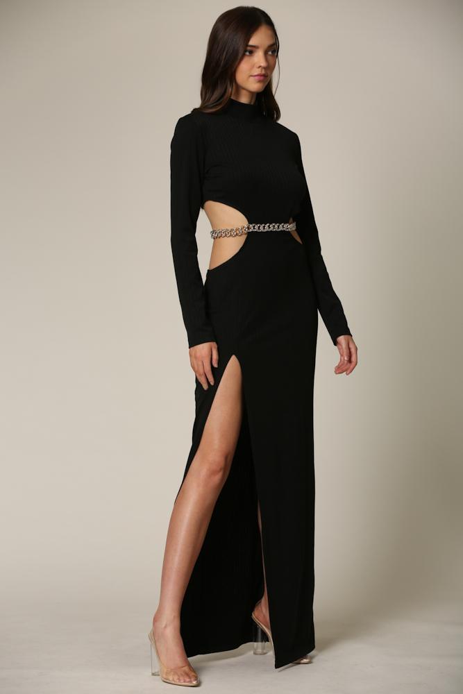 Elegant black maxi dress with high neckline and side slit, showcasing a sophisticated and modern design.