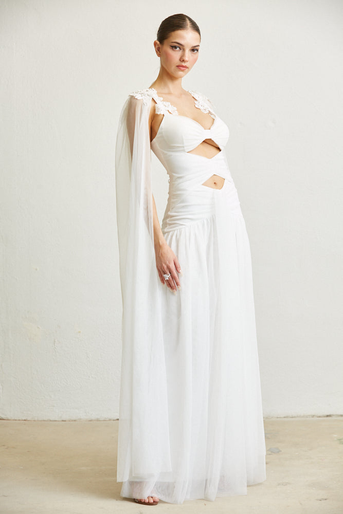 Elegant white floor-length dress with ruffled detailing, showcasing a sophisticated and refined style