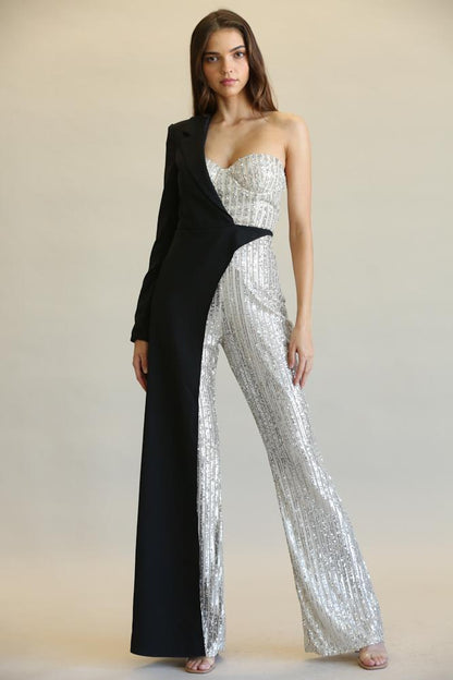 Elegant sequined jumpsuit with asymmetrical black and silver design, showcasing contemporary fashion style.