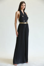 Load image into Gallery viewer, Elegant gold-buttoned black jumpsuit with pleated maxi skirt, showcasing a woman&#39;s sophisticated style.