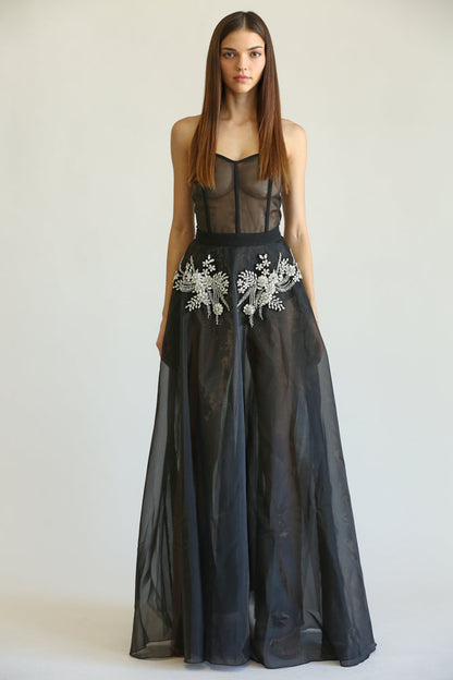 Elegant black dress with floral embroidered detailing, showcasing a stylish women's fashion design.