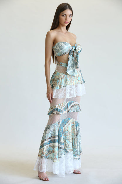 Elegant paisley print maxi dress with flared hem and ruffle detailing, showcasing a chic and feminine silhouette.