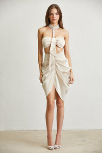 Elegant and contemporary white women's dress set with halter neckline, cutout waist, and asymmetrical skirt detailing.